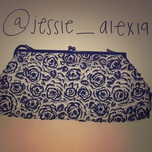 A black and white rose print Lancôme purse